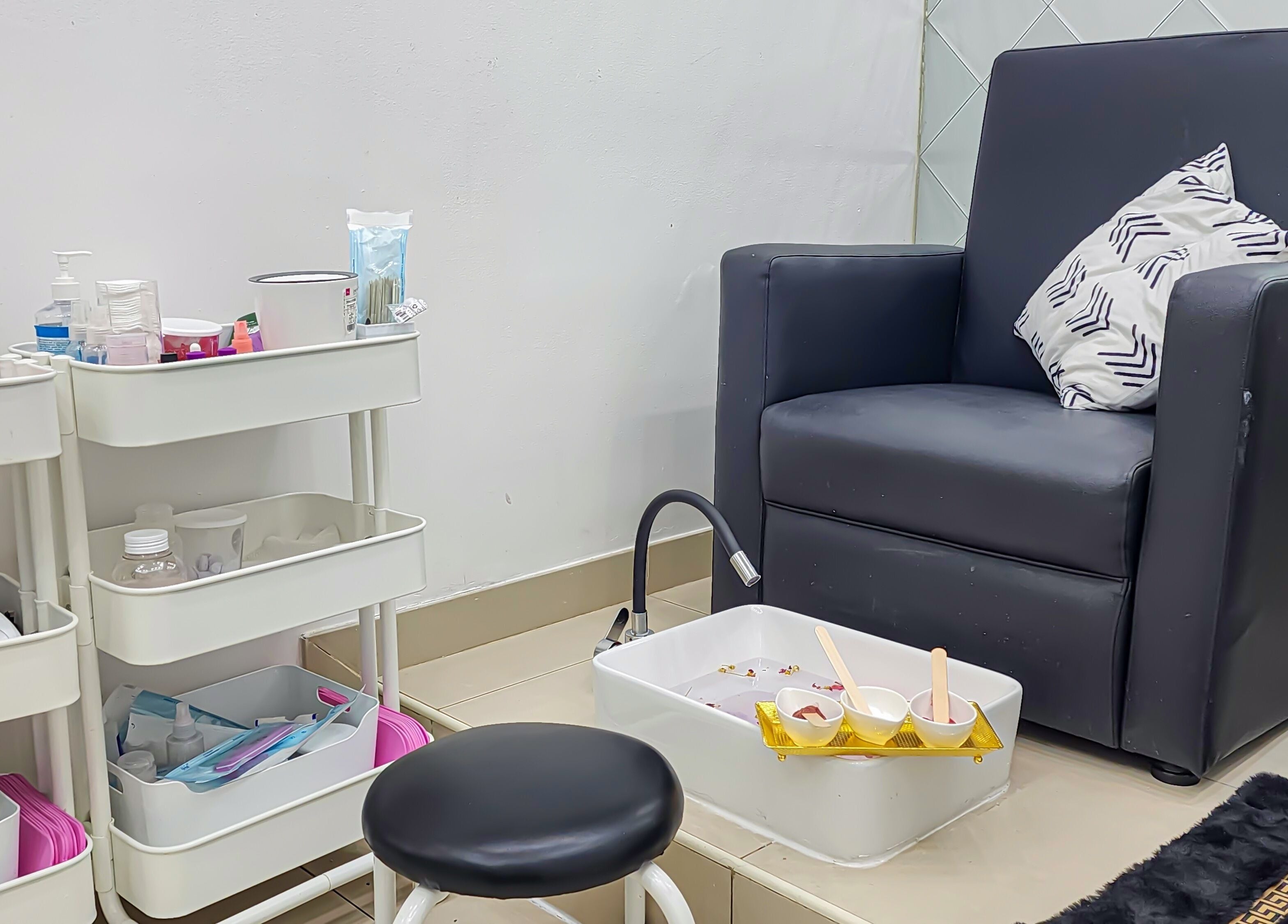 Relaxing pedicure setup at Cut and Colours Beauty Center, Abu Dhabi, Abu Dhabi, AE, featuring plush seating.
