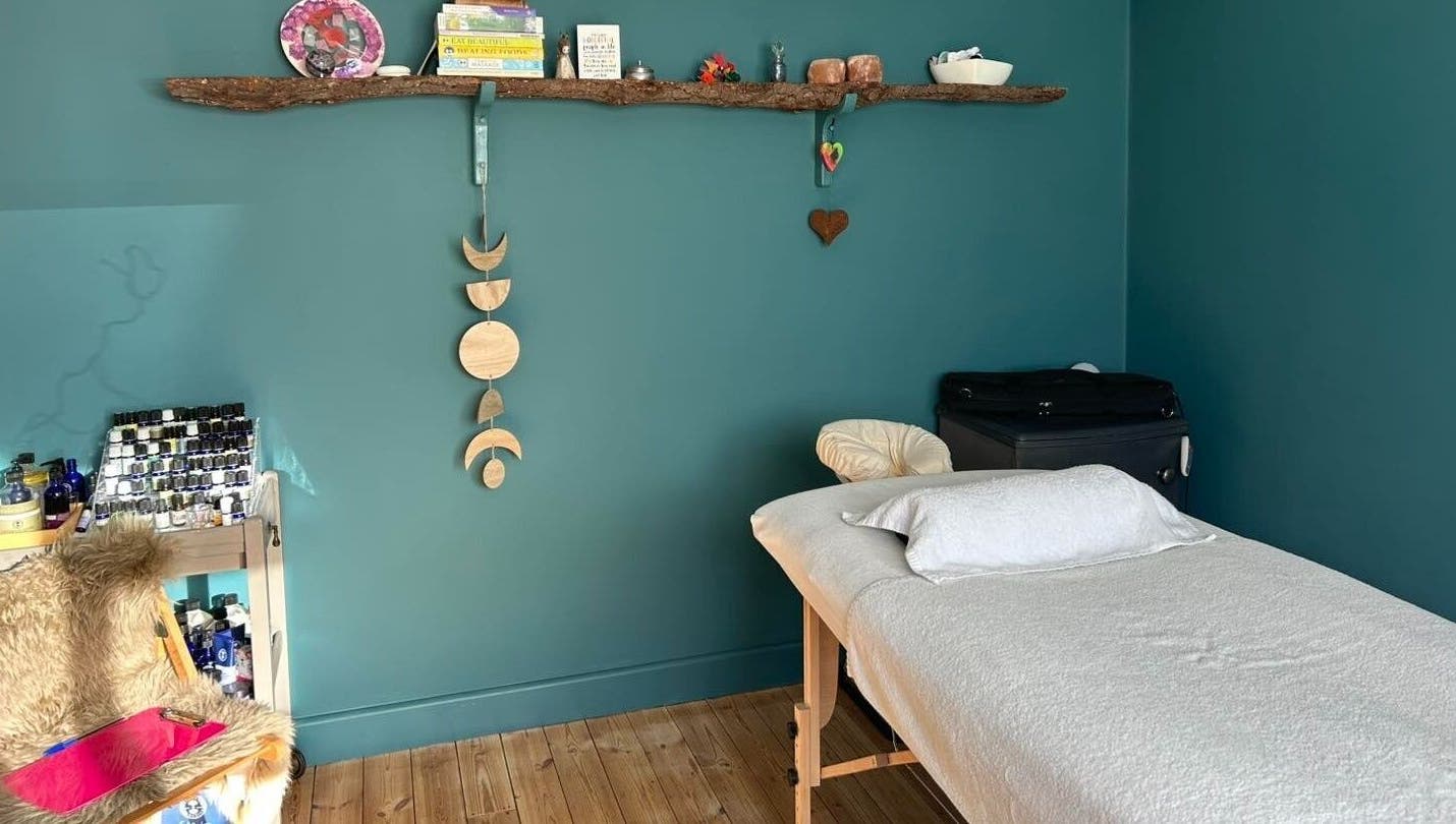 Peaceful treatment room at Natural Therapies with Kelly Aston, Gnosall, England, GB with massage table.