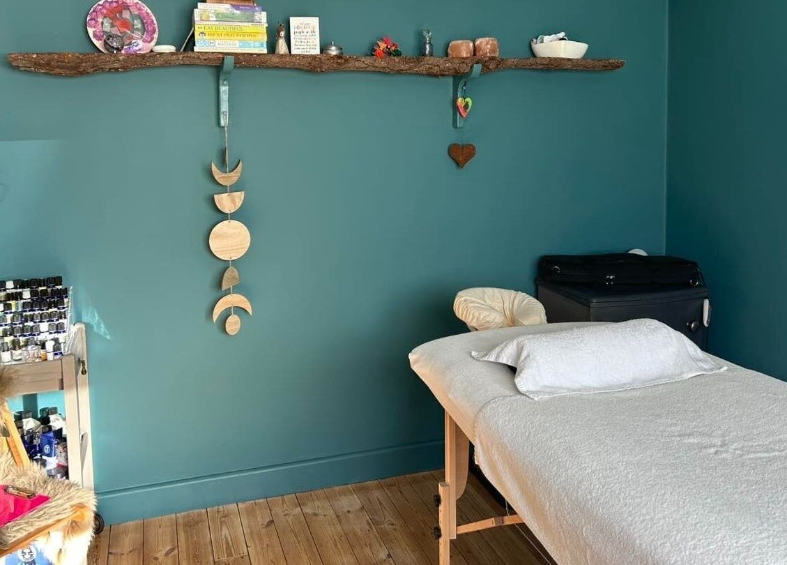 Peaceful treatment room at Natural Therapies with Kelly Aston, Gnosall, England, GB with massage table.