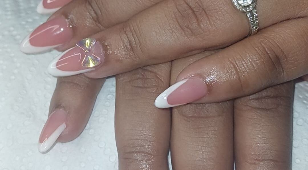 Elegant French manicure with rhinestones at N&h nail bar, Humansdorp, Eastern Cape, ZA.