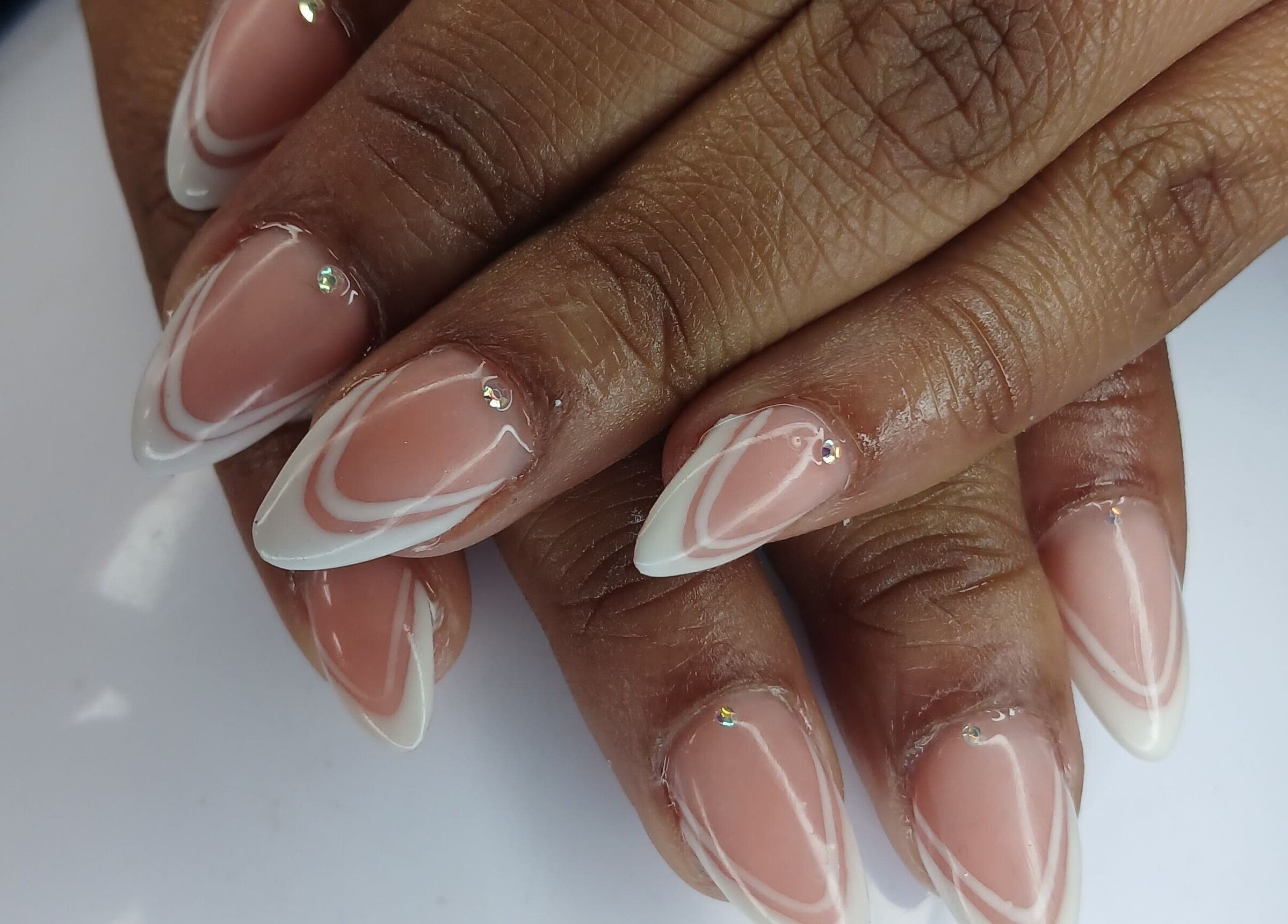 Stylish nail design with white patterns at N&h nail bar, Humansdorp, Eastern Cape, ZA.