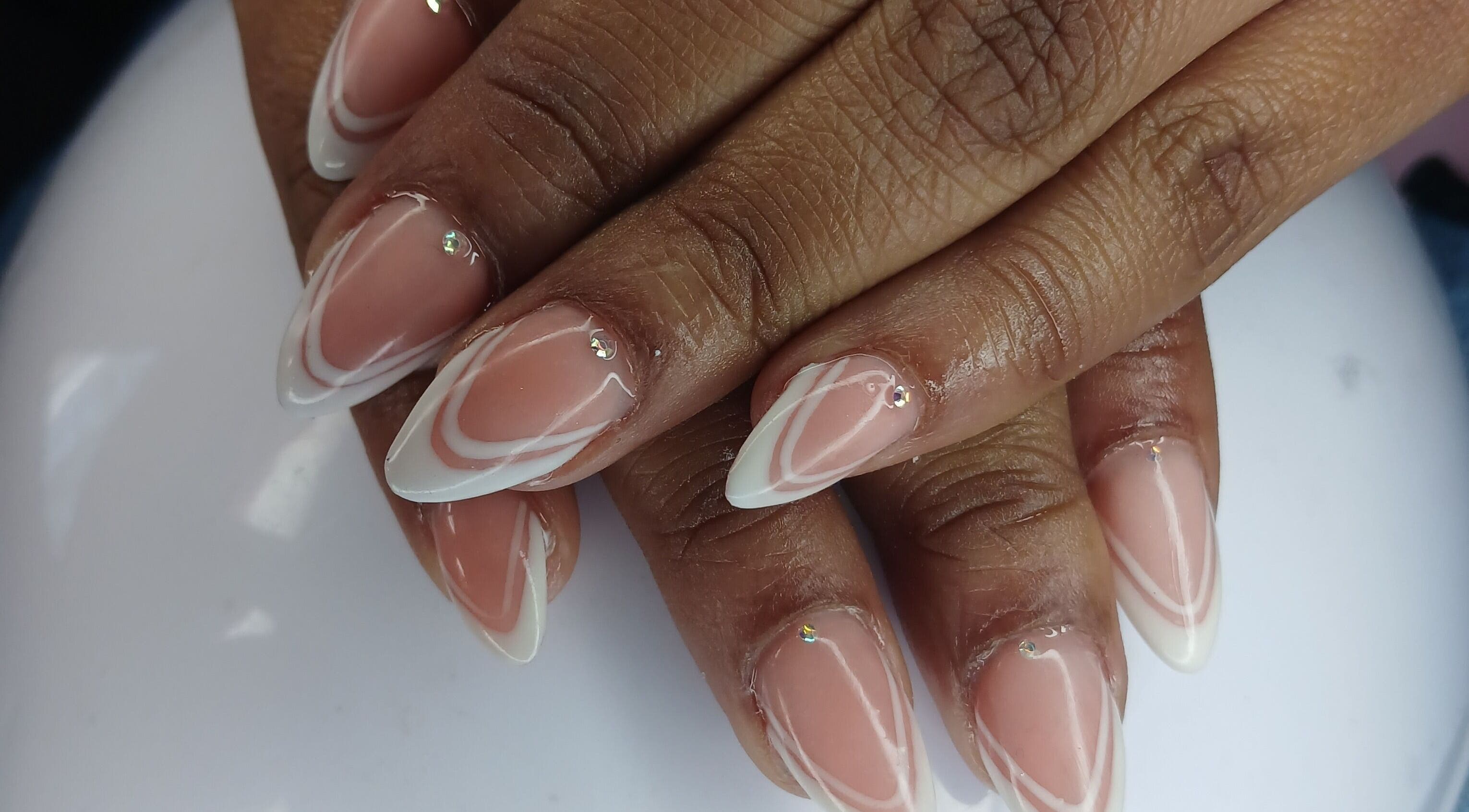 Stylish nail design with white patterns at N&h nail bar, Humansdorp, Eastern Cape, ZA.