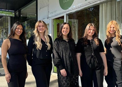 Team of stylists smiling outside Tuca Salon, Melbourne, Victoria, AU.