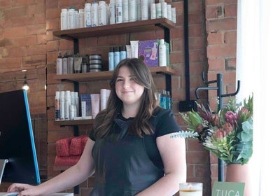 Friendly staff at Tuca Salon welcomes clients in Melbourne, Victoria, AU with a smile and a modern setup.