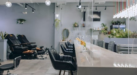 Interior of Color Me True Nail Bar in Nashville, Tennessee, US, featuring sleek modern decor and cozy seating.