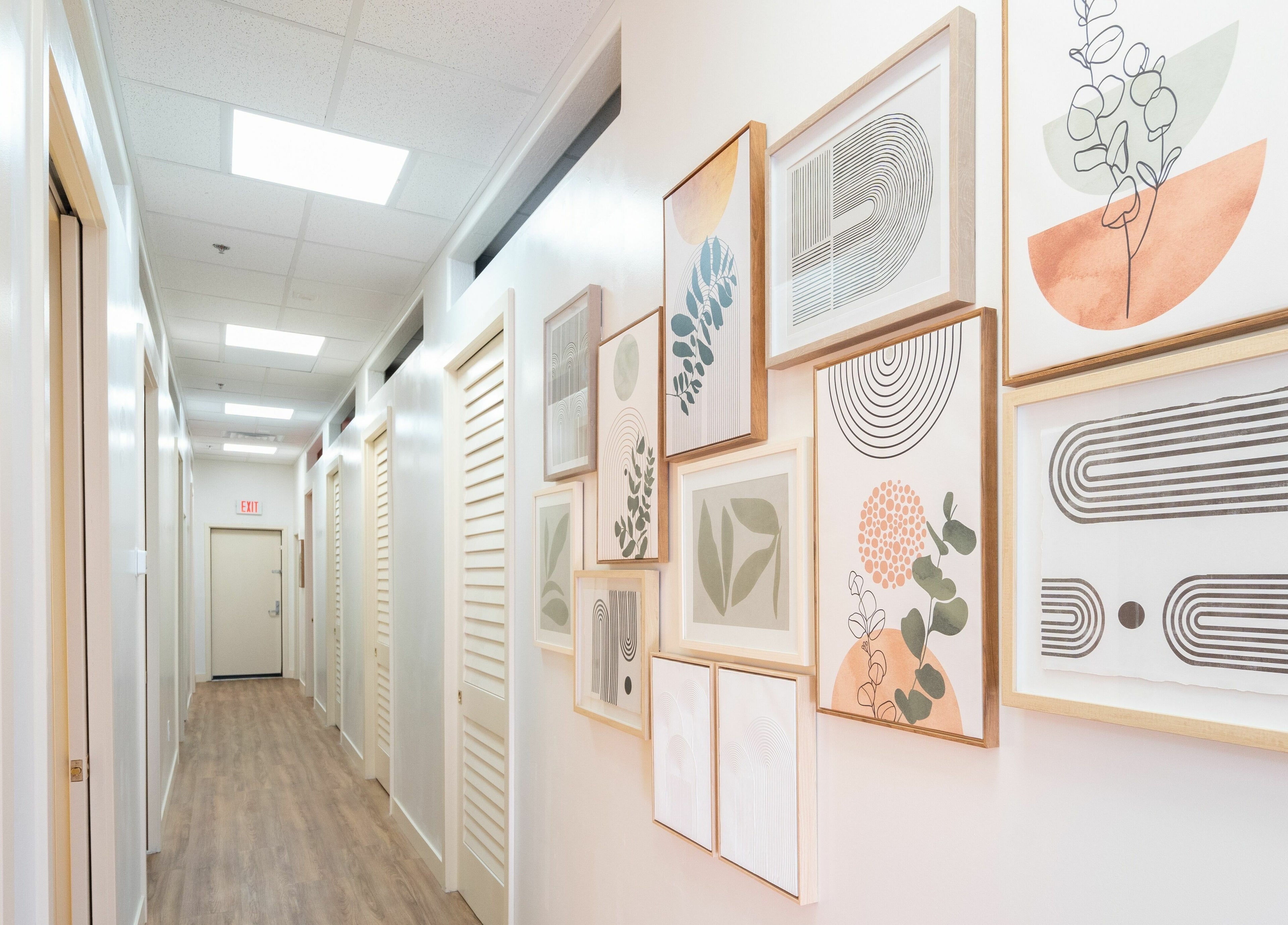 Glo House Sun Spa and Wellness Center in Las Vegas, Nevada, US. Hallway with modern art on walls.
