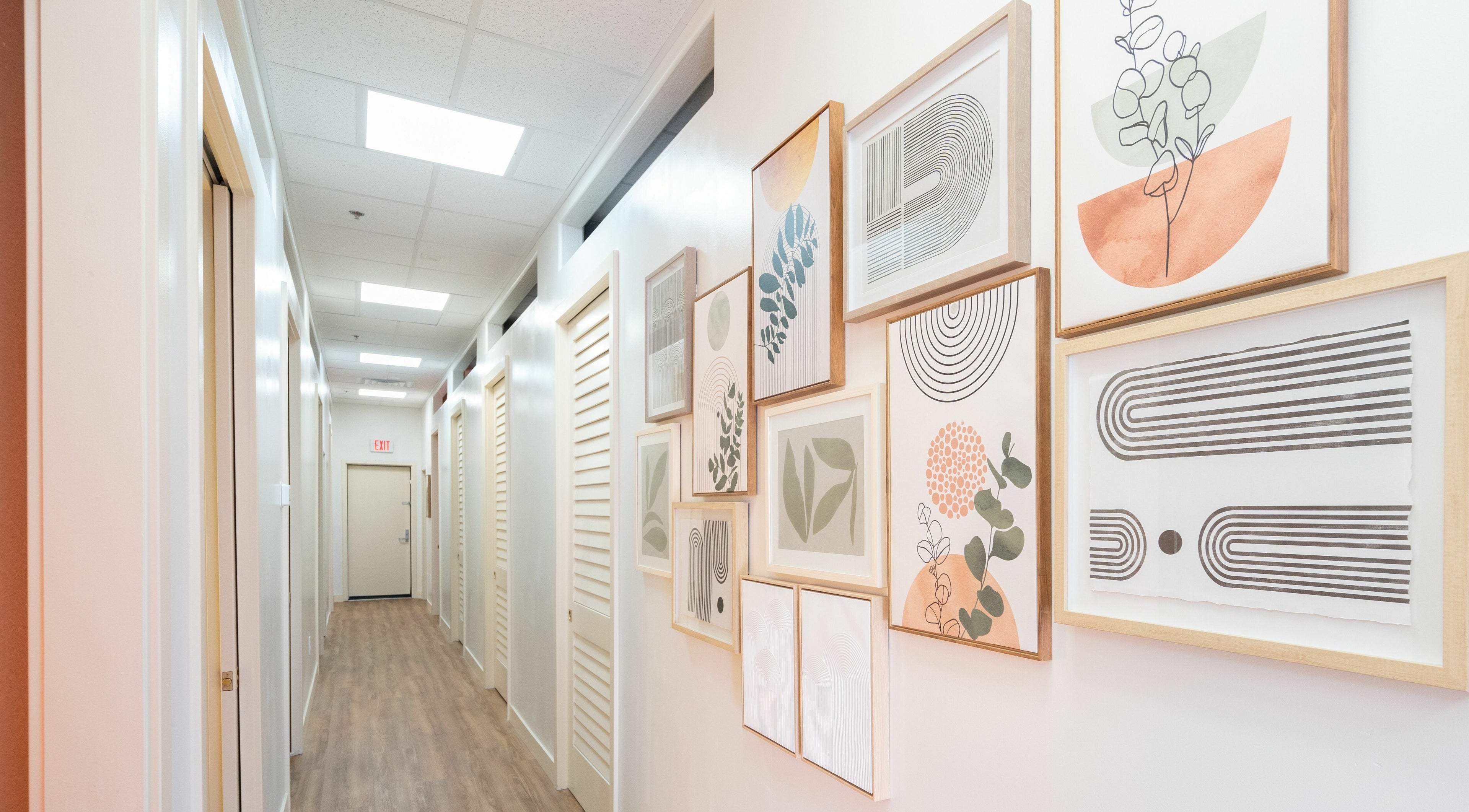 Glo House Sun Spa and Wellness Center in Las Vegas, Nevada, US. Hallway with modern art on walls.