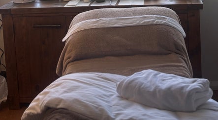 Cozy treatment room at Brows by Britt, Wollongong, New South Wales, AU, featuring a plush massage table.