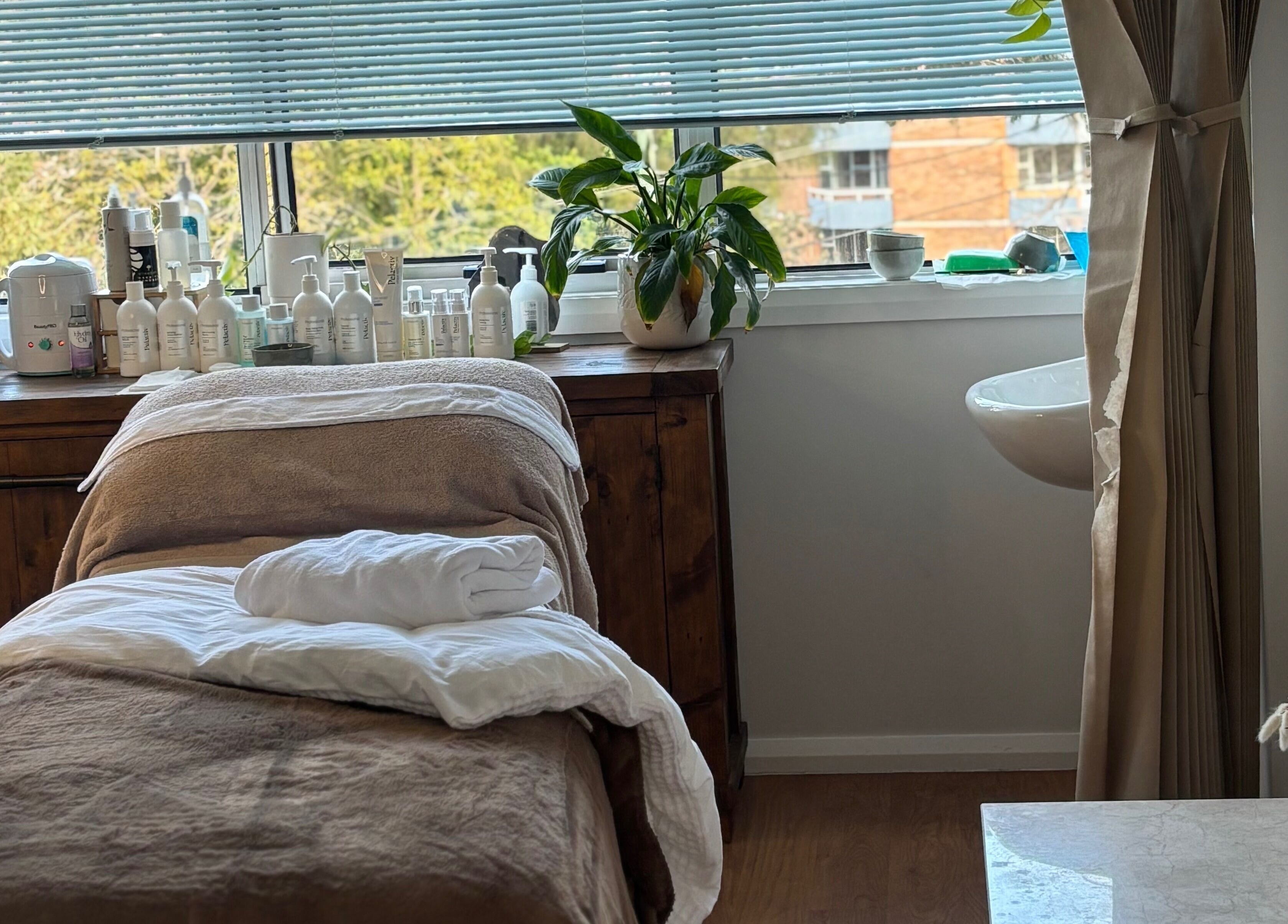 Elegant spa room at Brows by Britt, Wollongong, New South Wales, AU, with treatment bed and natural light.