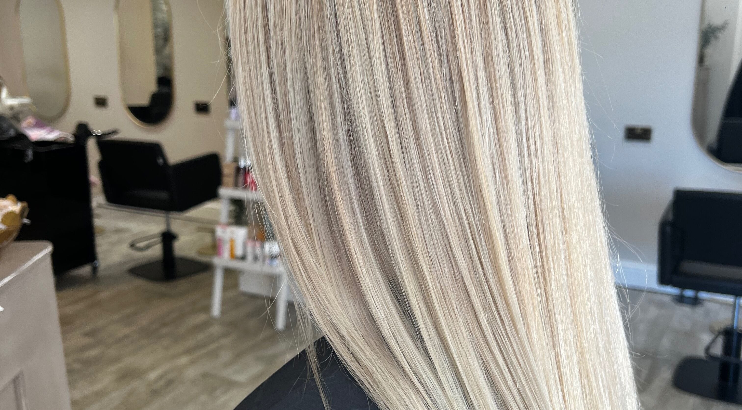 Blonde hair styled at Hair by BethanyG salon in Fareham, England, GB, showcasing sleek, shiny finish.