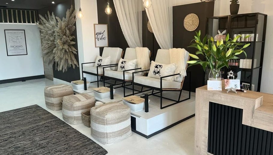 Luxurious nail lounge at SôR Salon, Pretoria, Gauteng, ZA featuring stylish seating and decor.