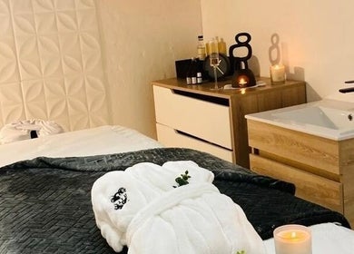 Relaxing spa room at SôR Salon, Pretoria, Gauteng, ZA, featuring a massage table and soothing ambiance.