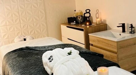 Relaxing spa room at SôR Salon, Pretoria, Gauteng, ZA, featuring a massage table and soothing ambiance.