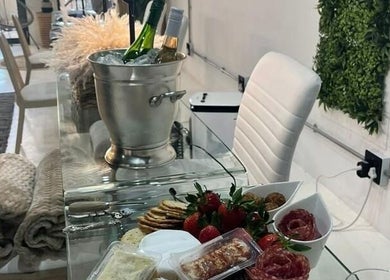 Chic interior with snacks and drinks at SôR Salon, Pretoria, Gauteng, ZA.