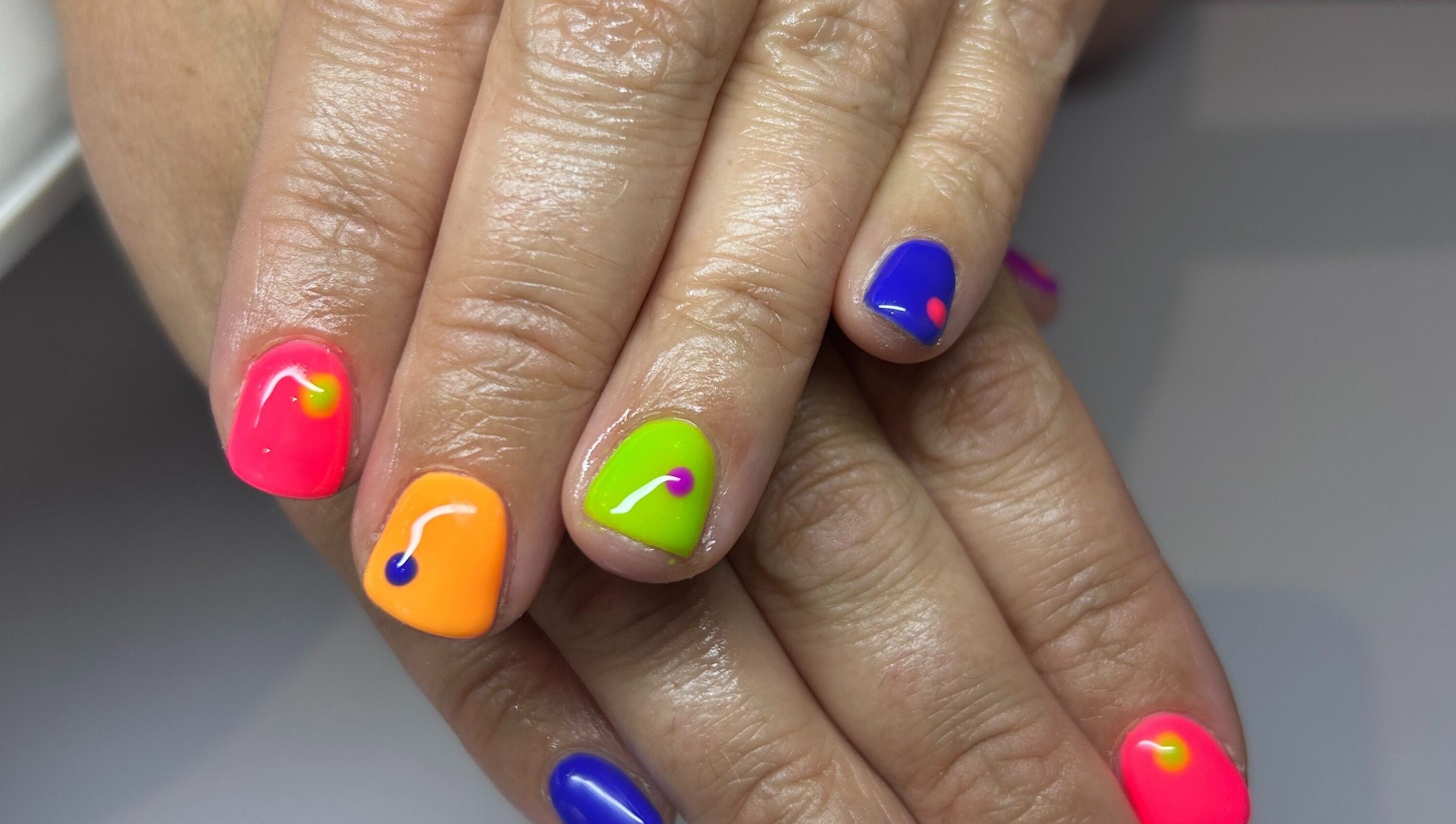 Colorful nail art at Bridie’s Beauty, Kessingland, England featuring neon shades.