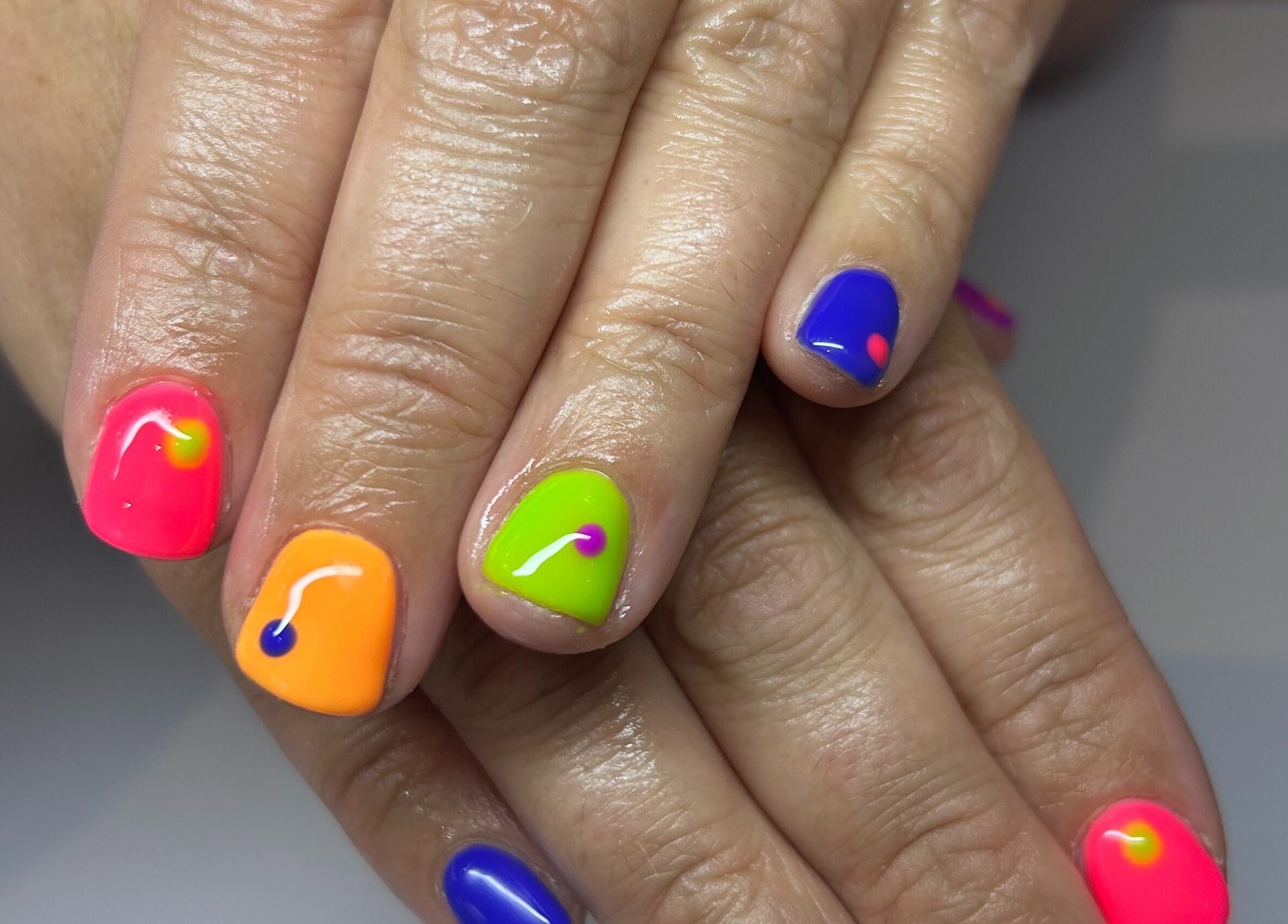 Colorful nail art at Bridie’s Beauty, Kessingland, England featuring neon shades.