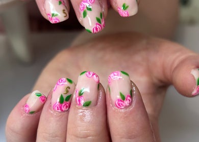 Elegant floral nail design at Bridie’s Beauty, Kessingland, England, GB, showcasing intricate pink rose details.
