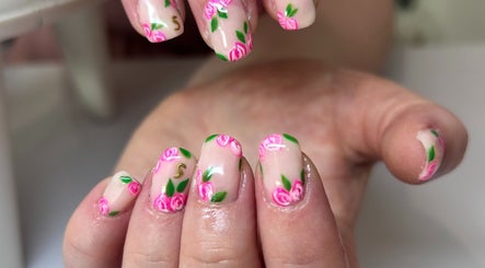 Elegant floral nail design at Bridie’s Beauty, Kessingland, England, GB, showcasing intricate pink rose details.