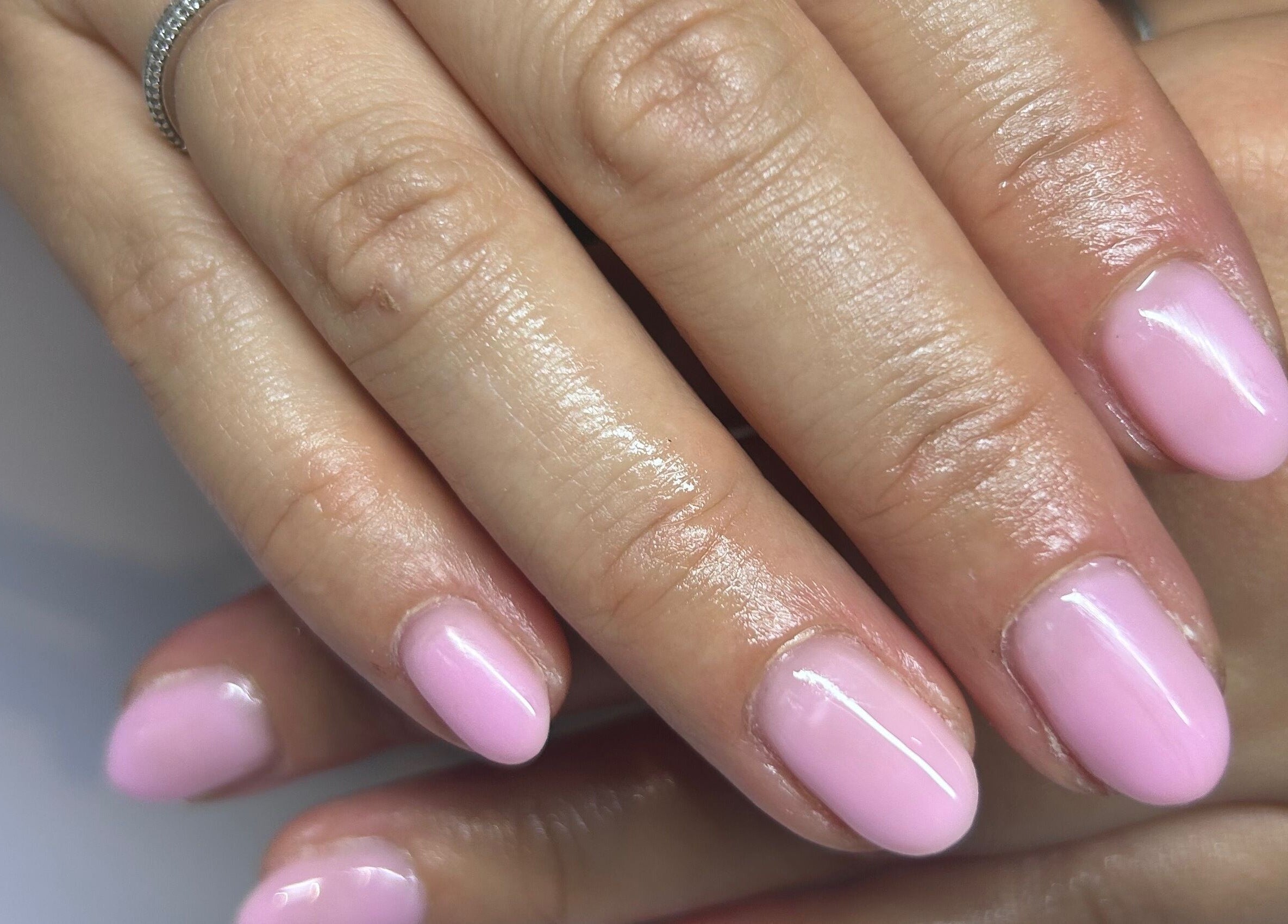 Manicured pink nails at Bridie’s Beauty, Kessingland, England, GB showcasing expert nail care.