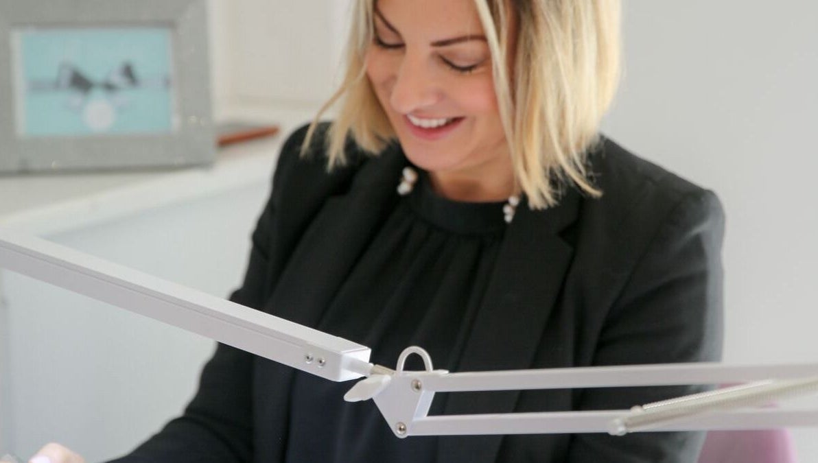 Smiling stylist working at Bridie’s Beauty at Flutterbye Lashes, Lowestoft, England, GB.