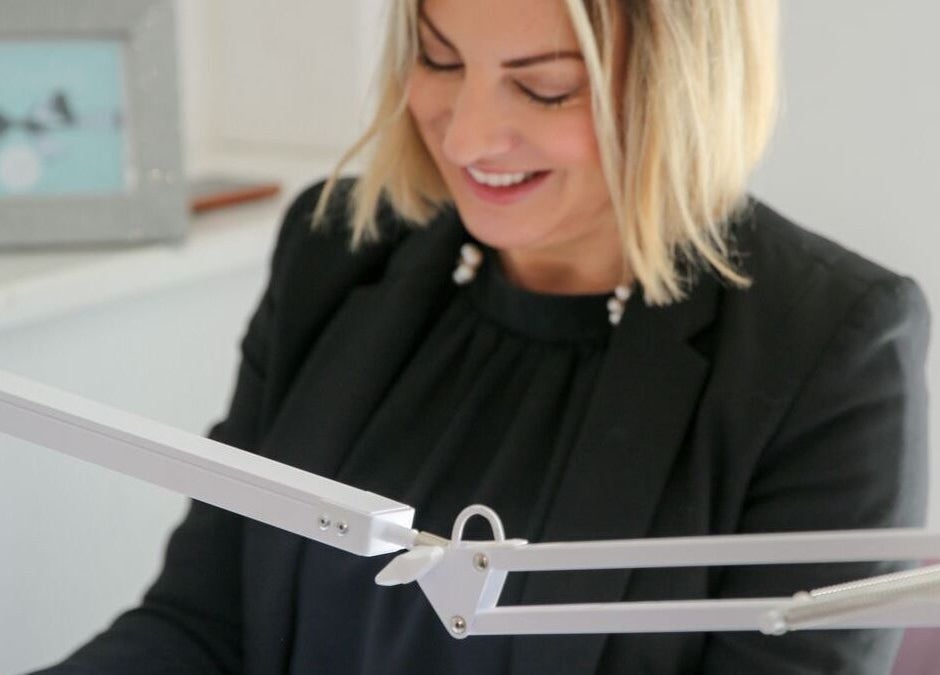 Smiling stylist working at Bridie’s Beauty at Flutterbye Lashes, Lowestoft, England, GB.