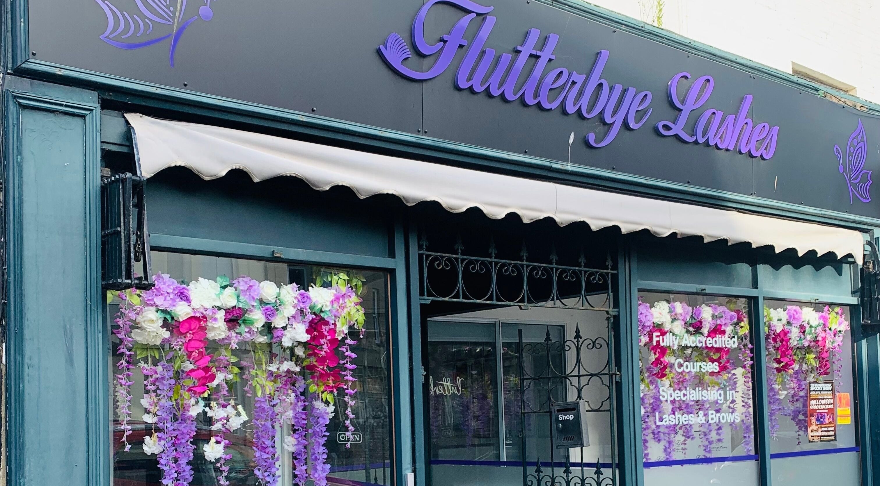 Front view of Bridie’s Beauty at Flutterbye Lashes, Lowestoft, England, GB with floral decorations.