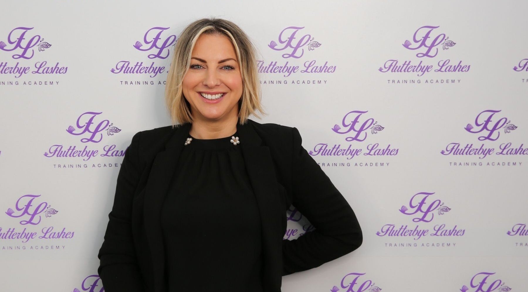 Bridie’s Beauty at Flutterbye Lashes, Lowestoft, England, showcases elegant branding backdrop.