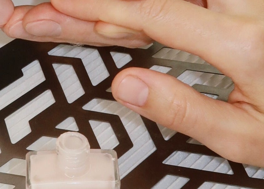 Manicure session in progress at STARR beautyspace, Tallinn, Harju maakond, EE with nail polish bottle.