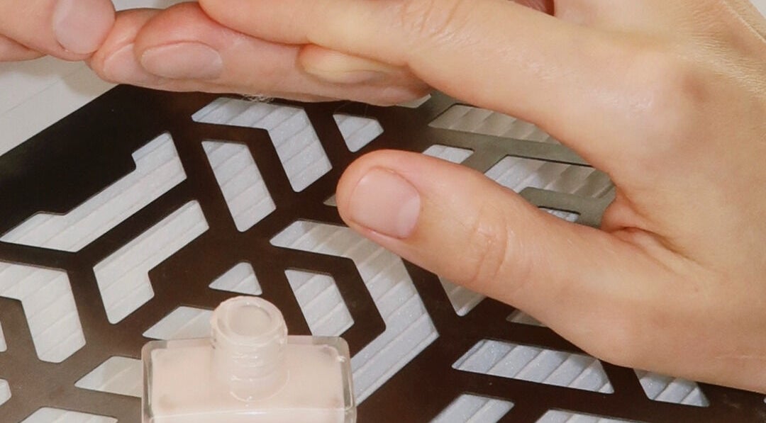 Manicure session in progress at STARR beautyspace, Tallinn, Harju maakond, EE with nail polish bottle.