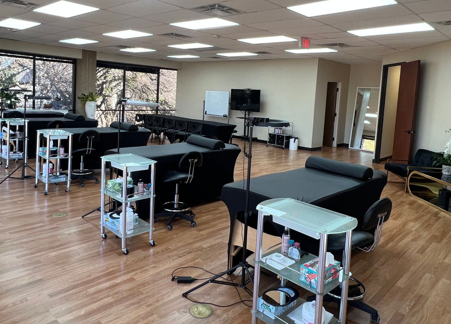 Bright, spacious interior of 5 Star Academy, Dallas, Texas, US. Features modern salon chairs and natural lighting.