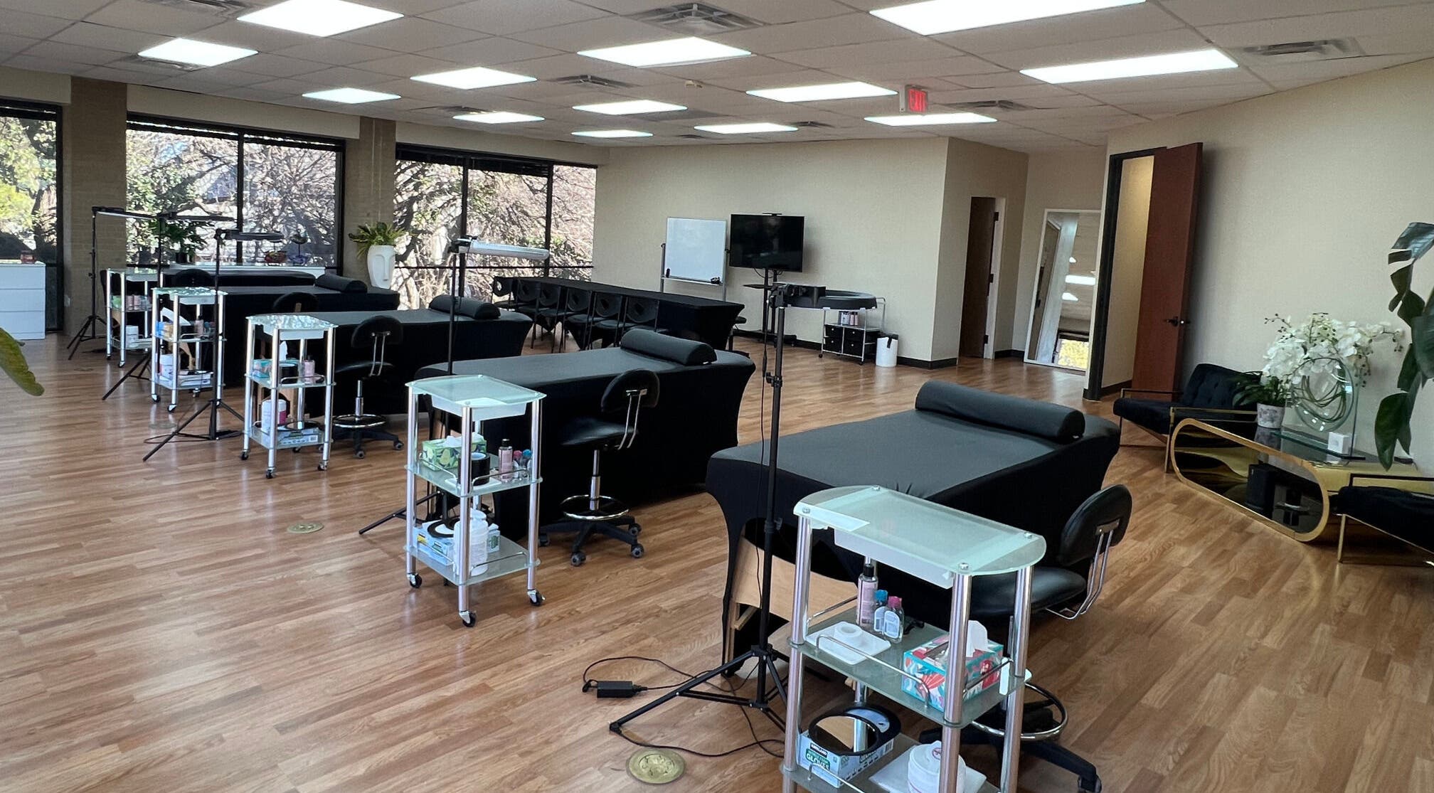 Bright, spacious interior of 5 Star Academy, Dallas, Texas, US. Features modern salon chairs and natural lighting.