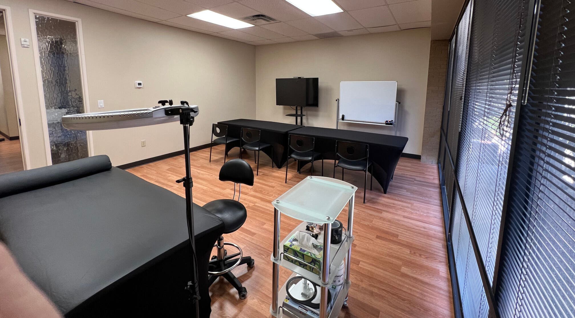Training room at 5 Star Academy, Dallas, Texas, US with tables, chairs, and lighting equipment.