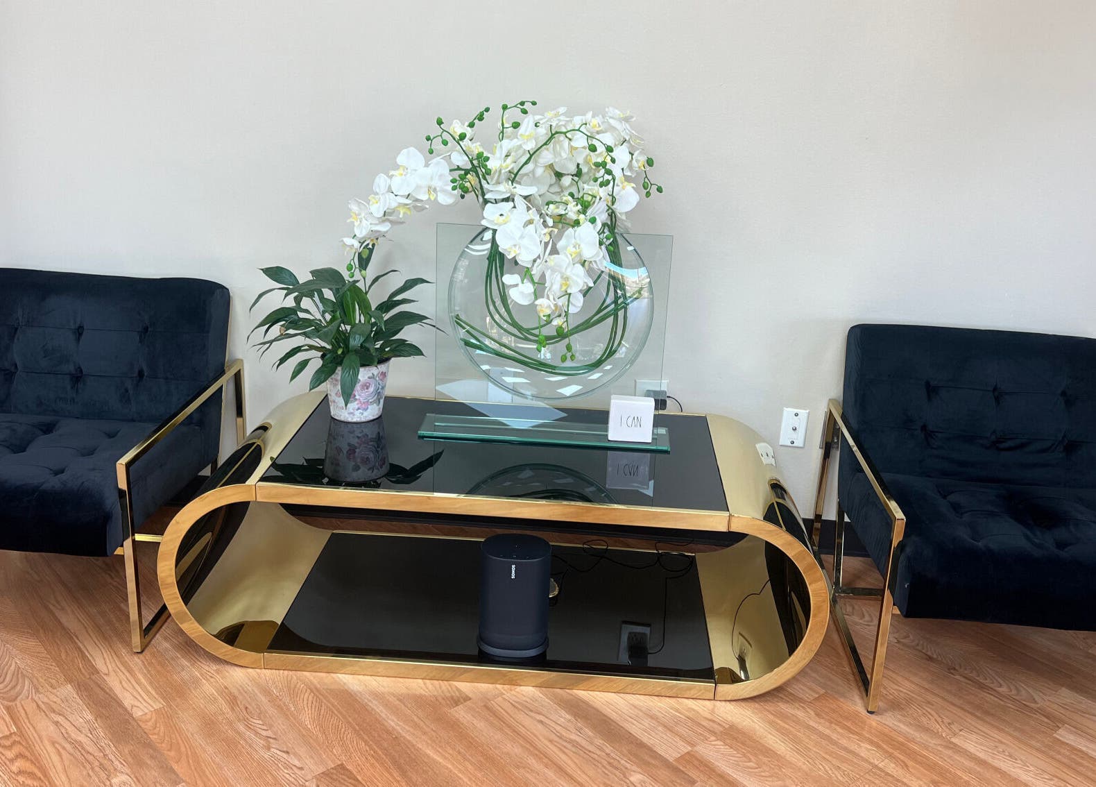 Stylish seating area at 5 Star Academy, Dallas, Texas, US with modern black chairs and floral decor.