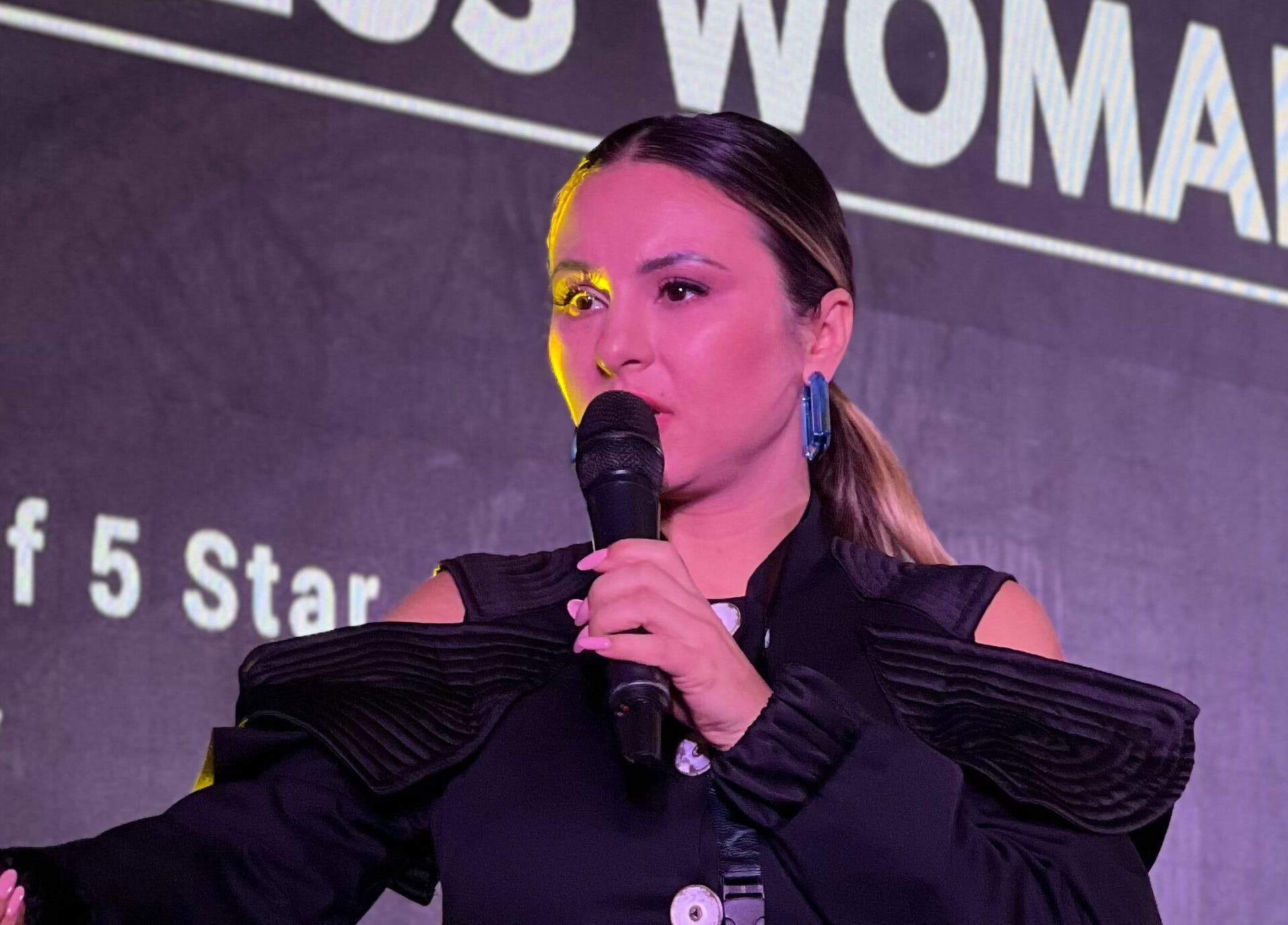 A speaker presenting at 5 Star Academy, Dallas, Texas, US, emphasizing beauty and wellness.