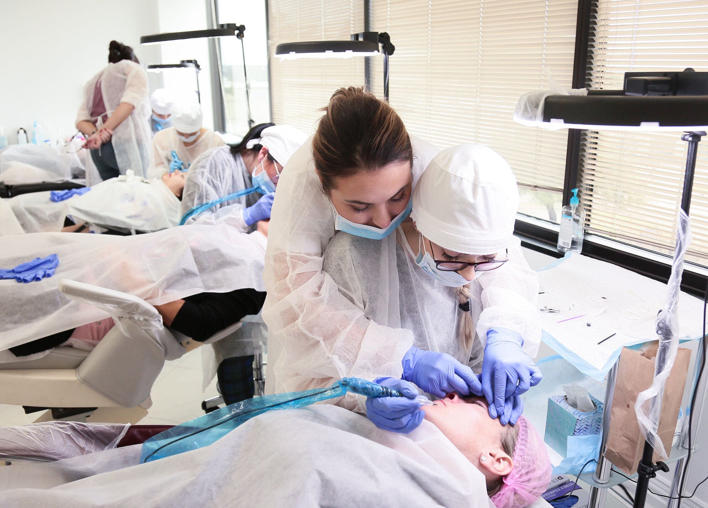 Students practice beauty techniques at 5 Star Academy, Dallas, Texas, US, enhancing professional skills in wellness.