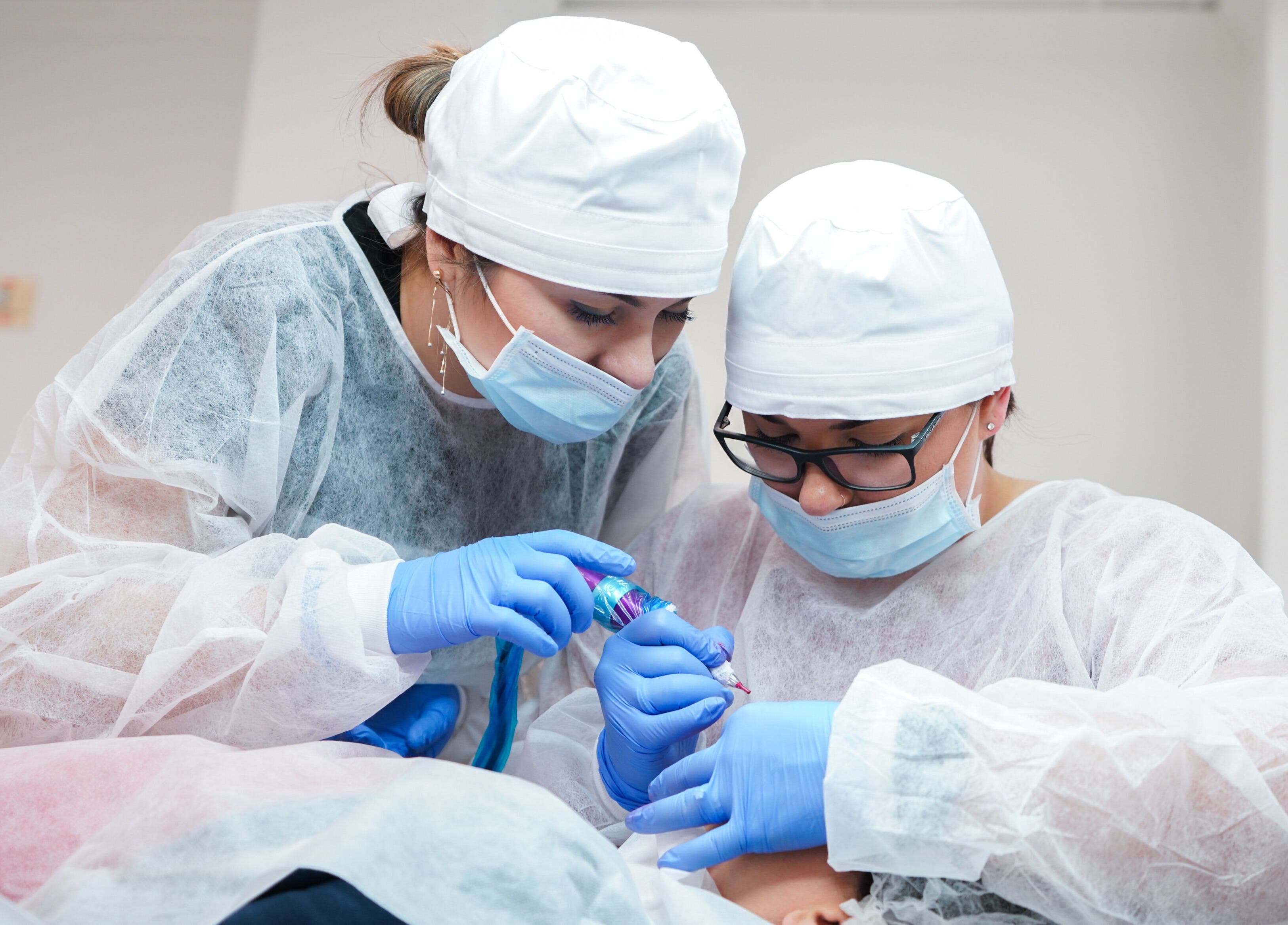 Professionals performing beauty treatment at 5 Star Academy, Dallas, Texas, US.