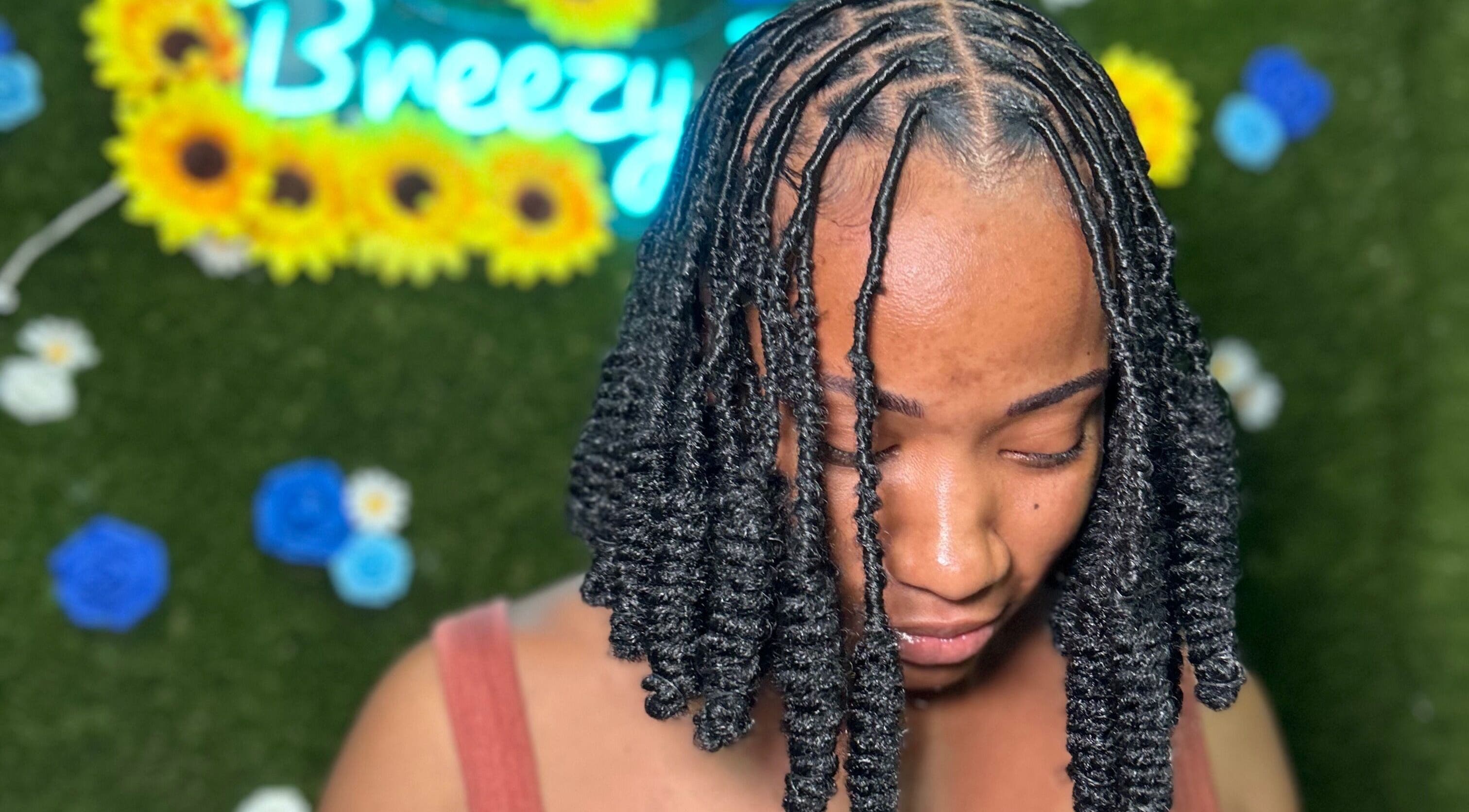 Woman with styled locs at Locs by Shawna, Montego Bay, St. James Parish, JM.