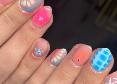 Unique nail art design at Faye Mcc Beauty, Kells, Northern Ireland, GB showcasing vibrant sea-themed patterns.