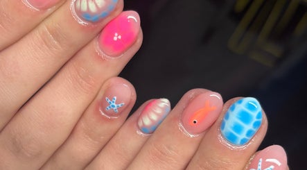 Unique nail art design at Faye Mcc Beauty, Kells, Northern Ireland, GB showcasing vibrant sea-themed patterns.