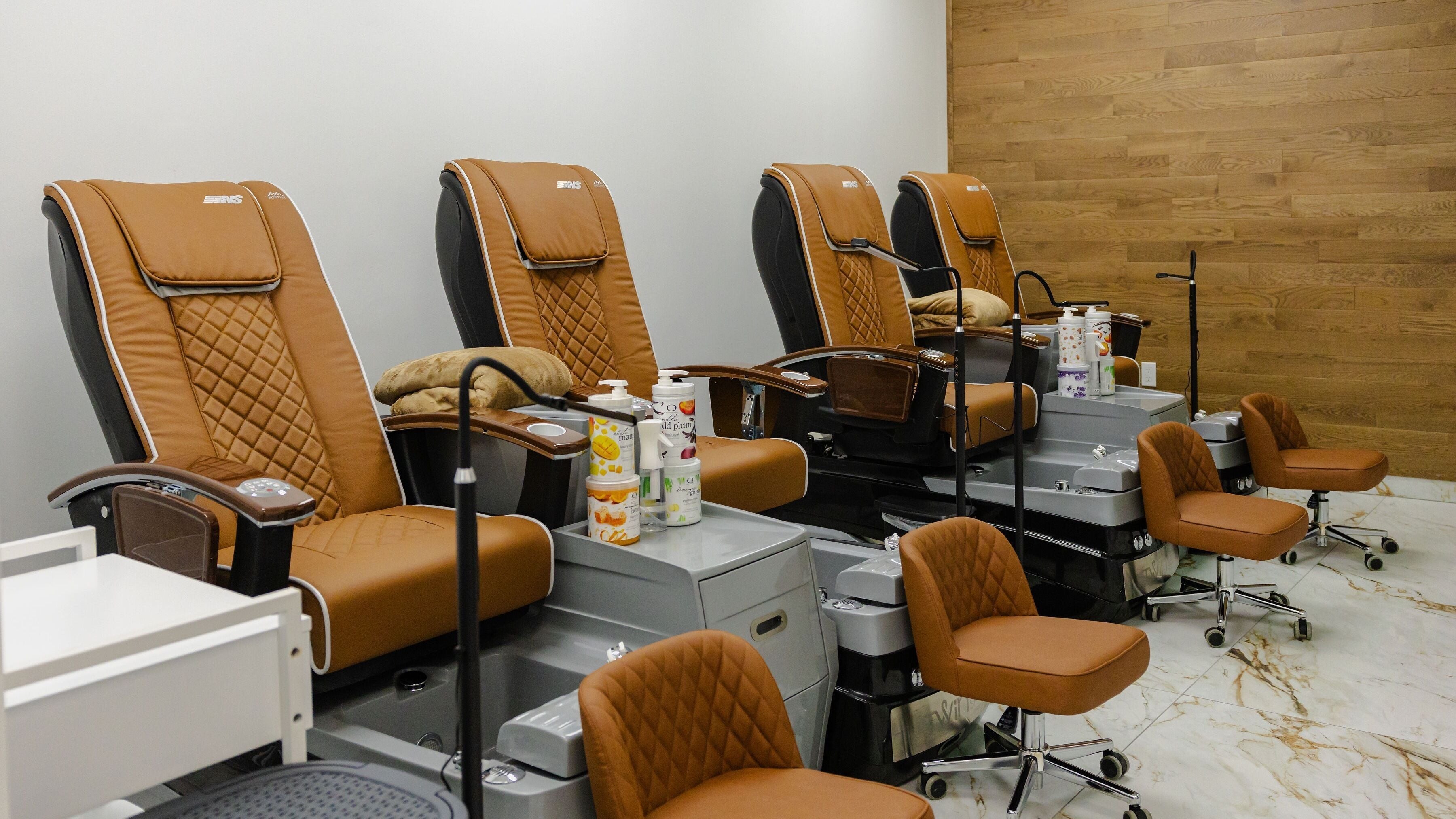 Comfortable pedicure chairs at ODU - Vogue Lashes & Spa in Norfolk, Virginia, US, enhancing relaxation.