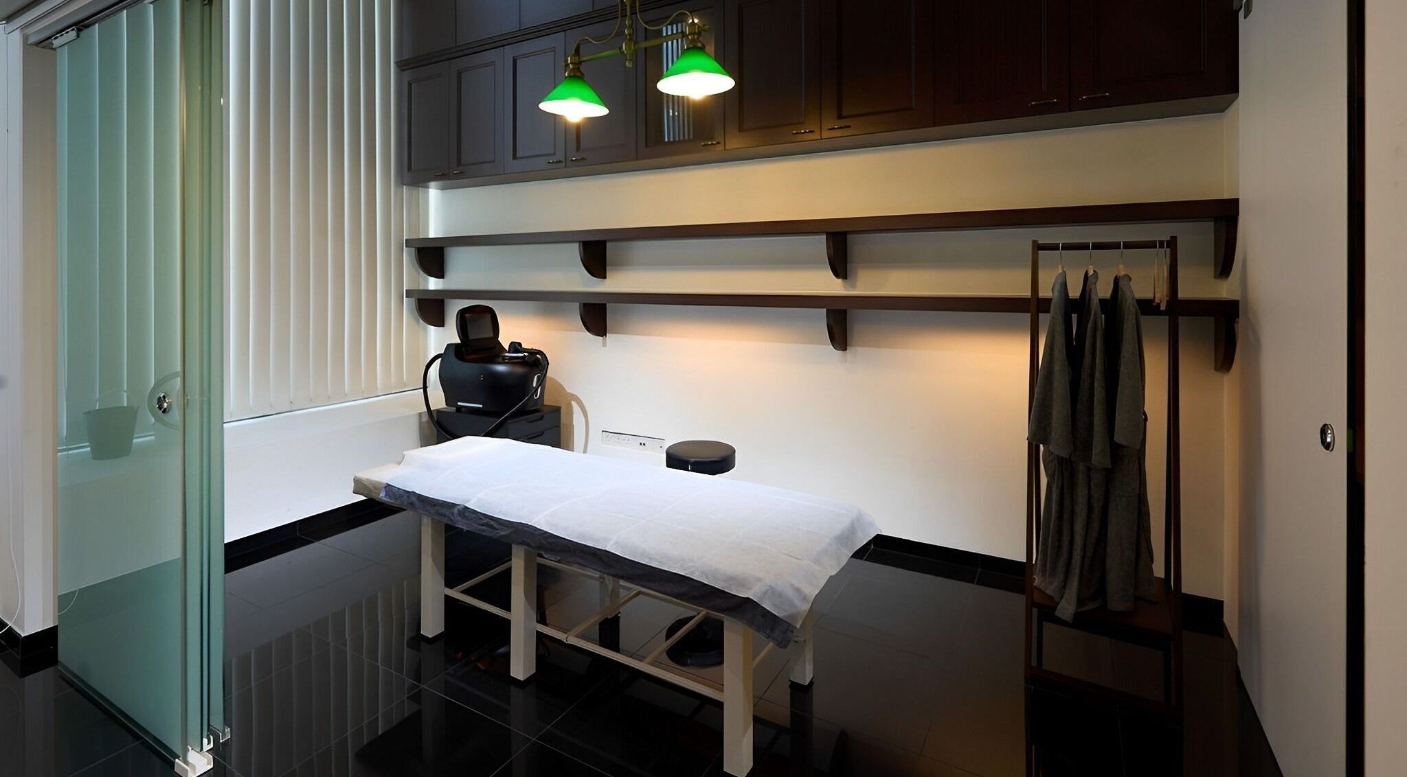 Elegant treatment room at Hair Removal Brush Up, Singapore, Singapore, SG, featuring a comfortable massage table.