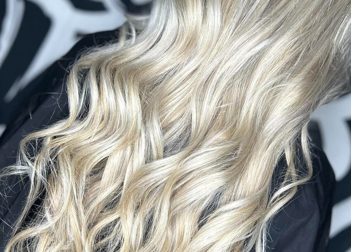 Stylish blonde waves at Emily ~ Janes, Doncaster, England, GB showcasing hair expertise.