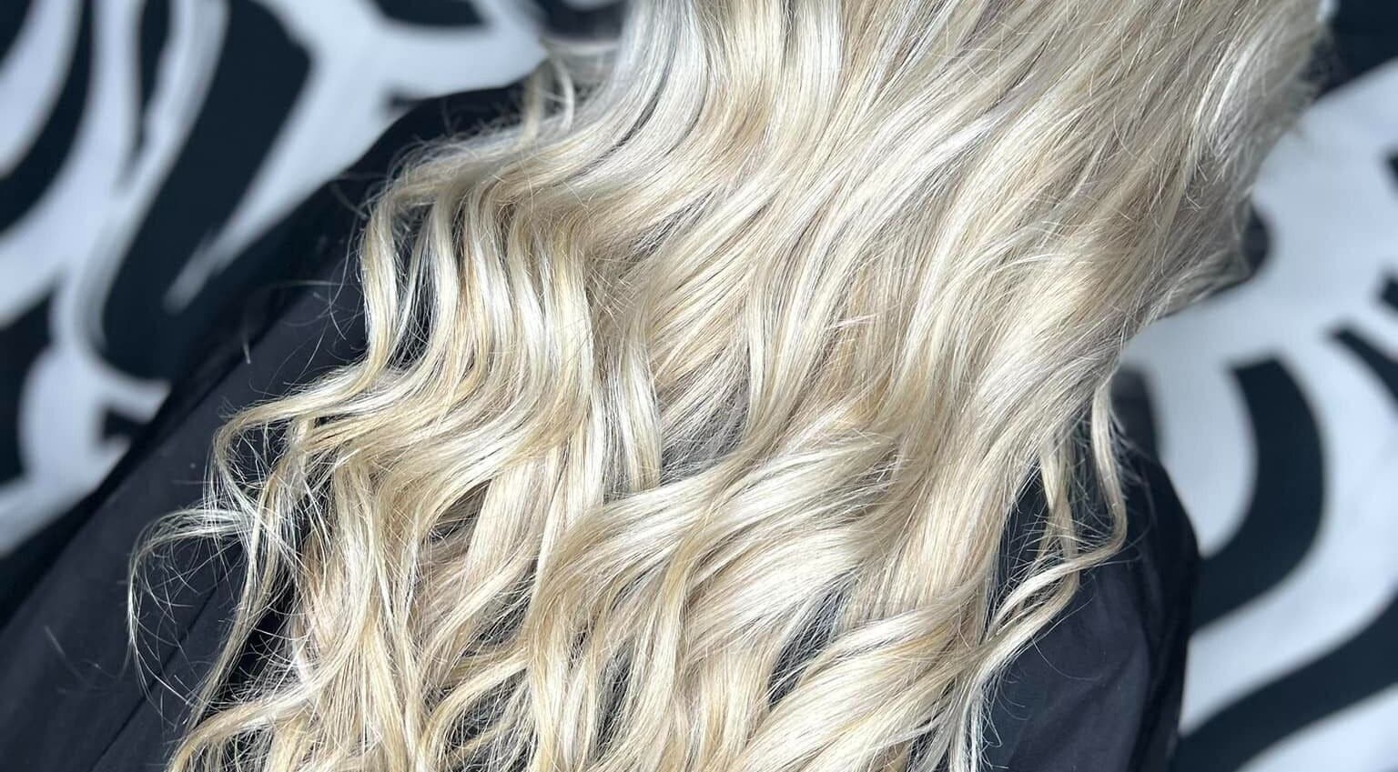 Stylish blonde waves at Emily ~ Janes, Doncaster, England, GB showcasing hair expertise.