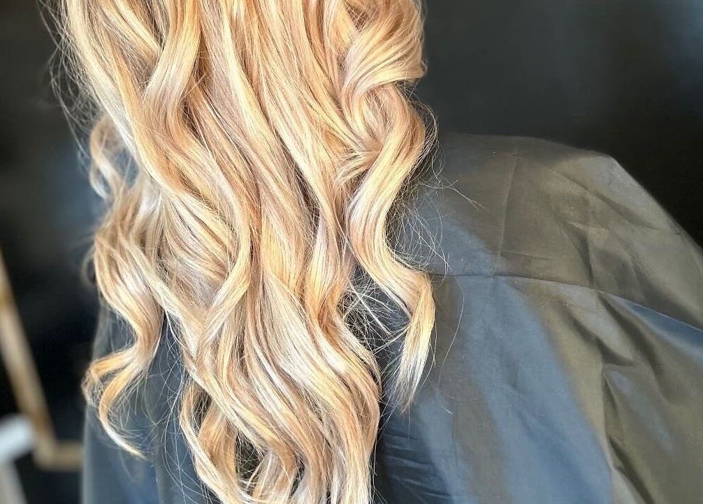 Blonde curled hairstyle at Emily ~ Janes, Doncaster, England, GB, showcasing luxurious salon results.
