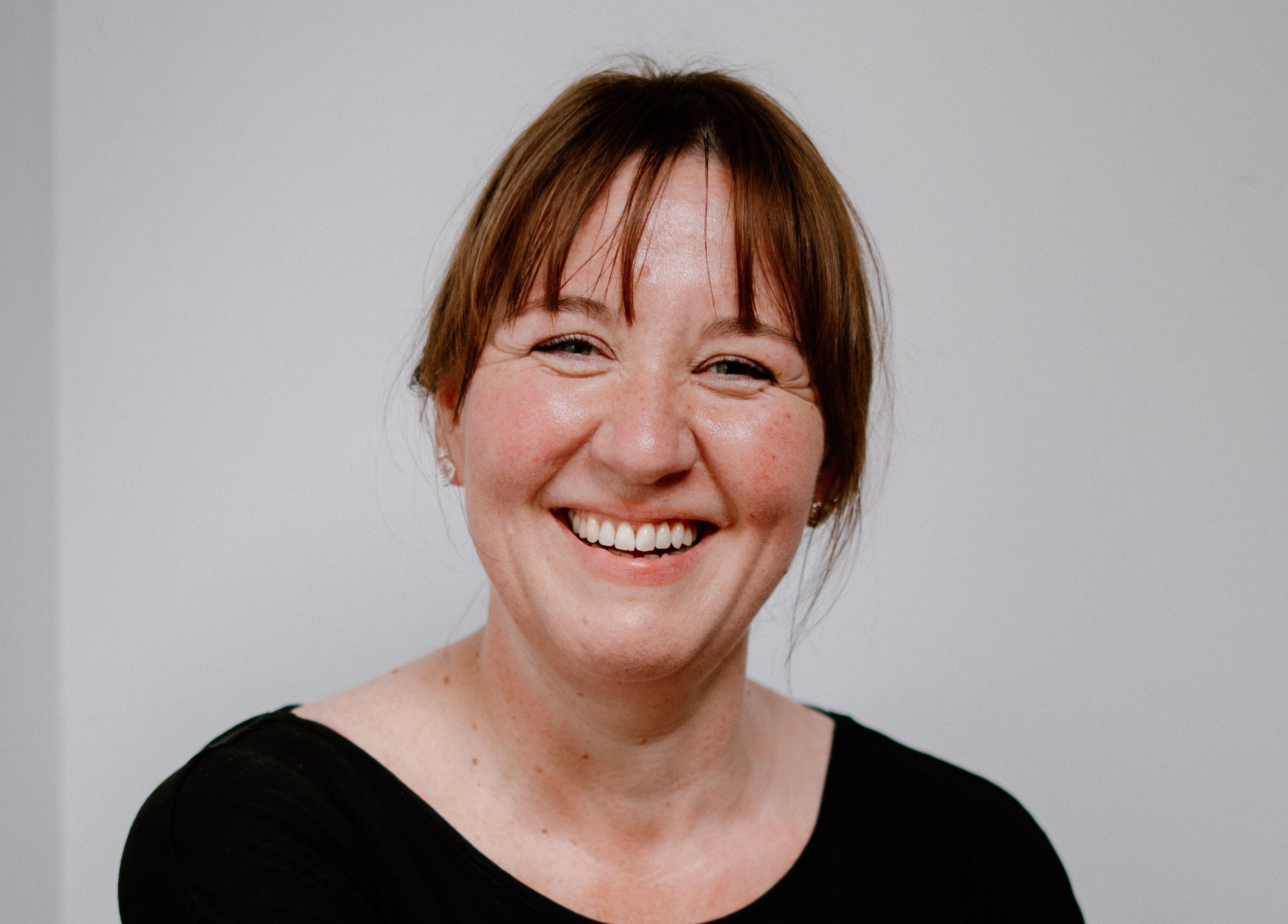 Smiling woman at The Sanctuary at Sass, Marsden, England, GB. Capturing the warmth of the venue.