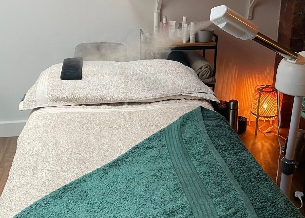 Massage room at The Sanctuary at Sass, Marsden, England, GB, showcasing a cozy massage table and spa equipment.