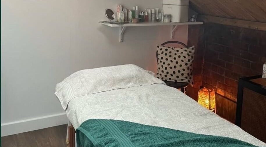 Relaxing massage room at The Sanctuary at Sass, Marsden, England, GB with a cozy bed and soft lighting.