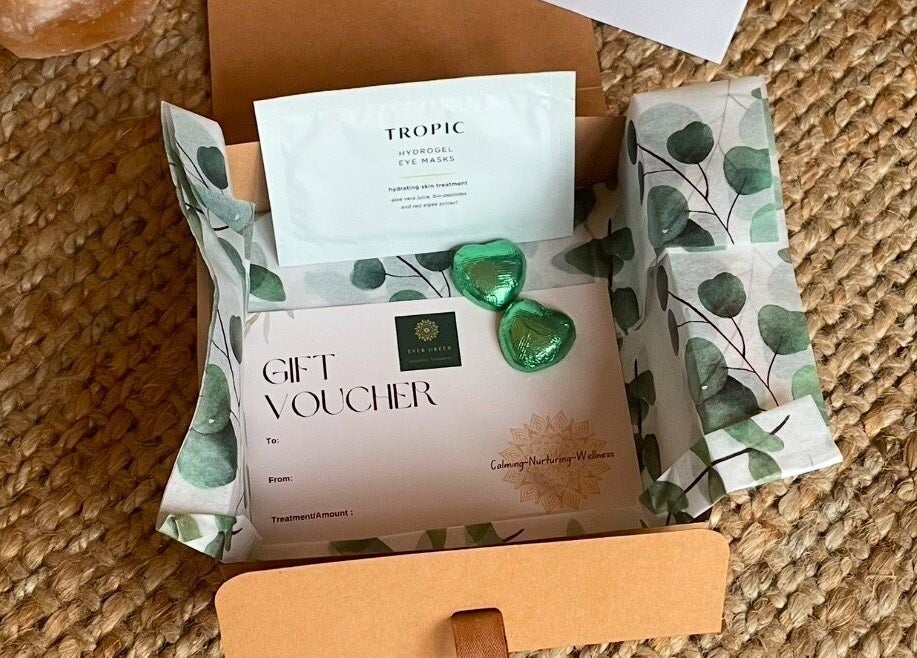 Gift voucher with beauty items at The Sanctuary at Sass, Marsden, England, GB in a decorative box.