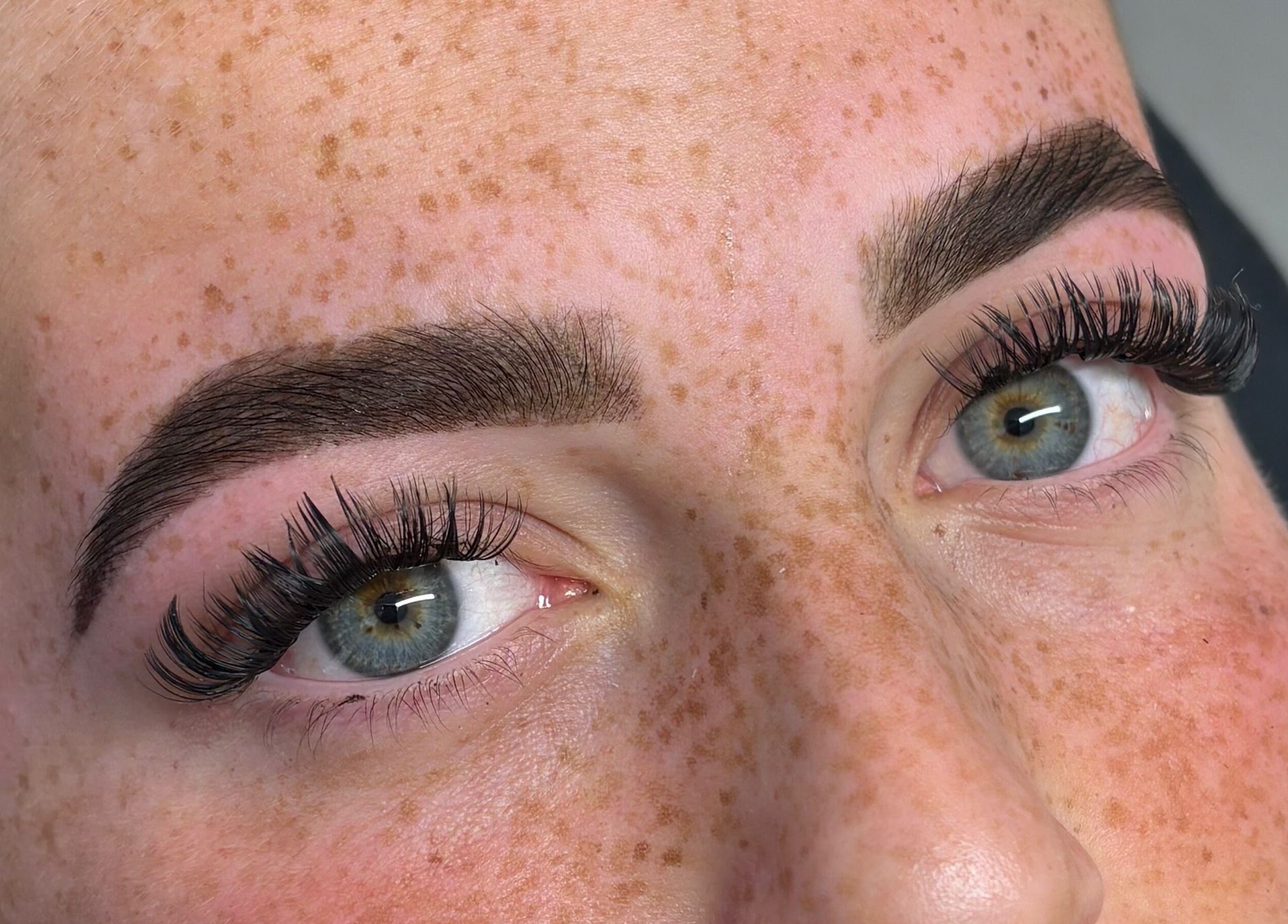 Close-up of perfectly shaped brows and lashes at By Lottie, Wellingborough, England, GB.