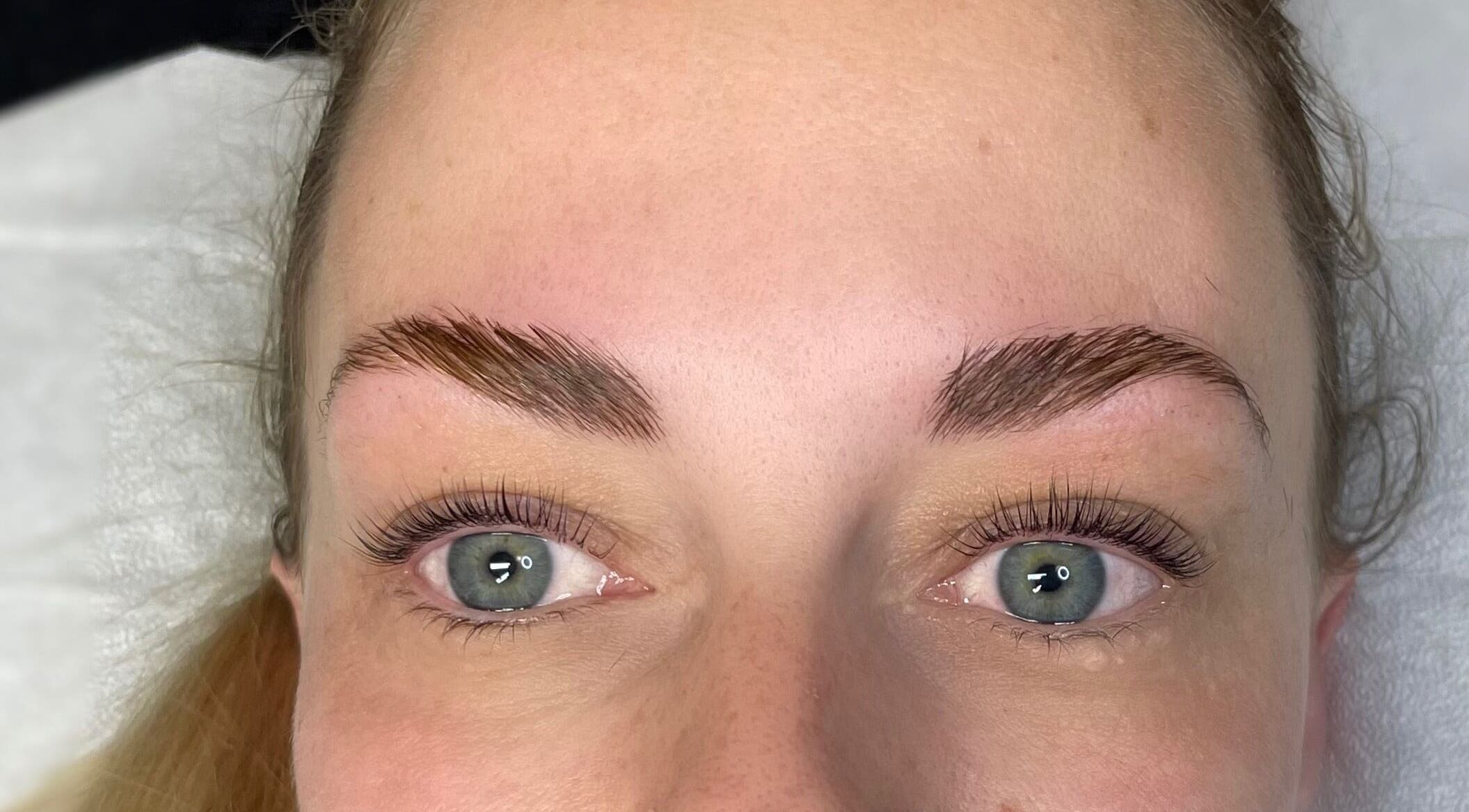 Close-up of expertly styled brows and lashes at Sass Lash Infusion, Cochrane, Alberta, CA.